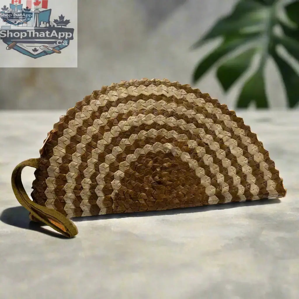 Pandan leaf clutch purse in half moon design with natural mixed tones by Suzie Blue Canada, showcasing textured leaf pattern.