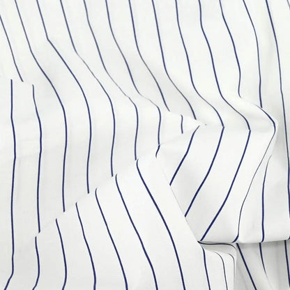 Navy striped organic cotton duvet cover by Skylark+Owl Canada, featuring smooth percale fabric and modern style.