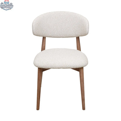 Nikari natural wood Cammy dining chair by Hygge Design House with sleek, modern design and curved backrest for comfortable seating.