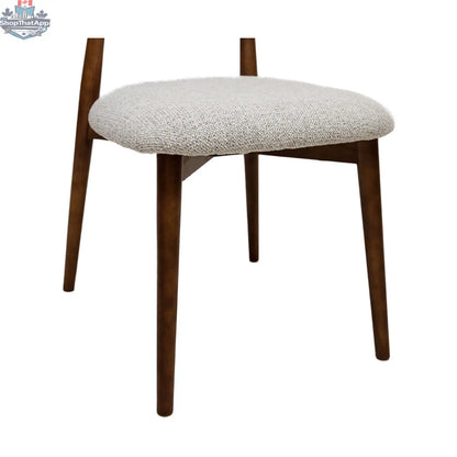 Light grey Hygge Design House Cammy dining chair with sleek wooden frame and cushioned seat, modern and stylish for dining rooms.