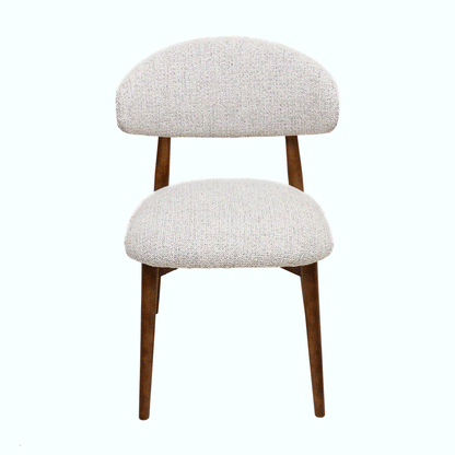 Light grey Hygge Design House Cammy dining chair with wooden legs and modern, minimalist style.