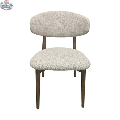 Light grey Hygge Design House Cammy Dining Chair with wooden legs and modern, sleek design for dining rooms.