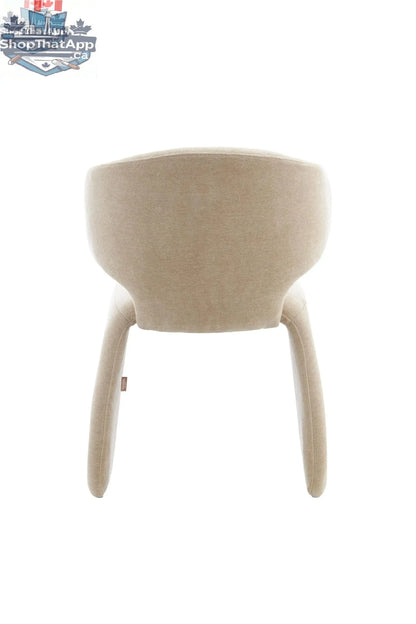 Oriana sculpted dining chair in dusty beige with a modern design, featuring smooth curves and wooden legs for stylish dining.