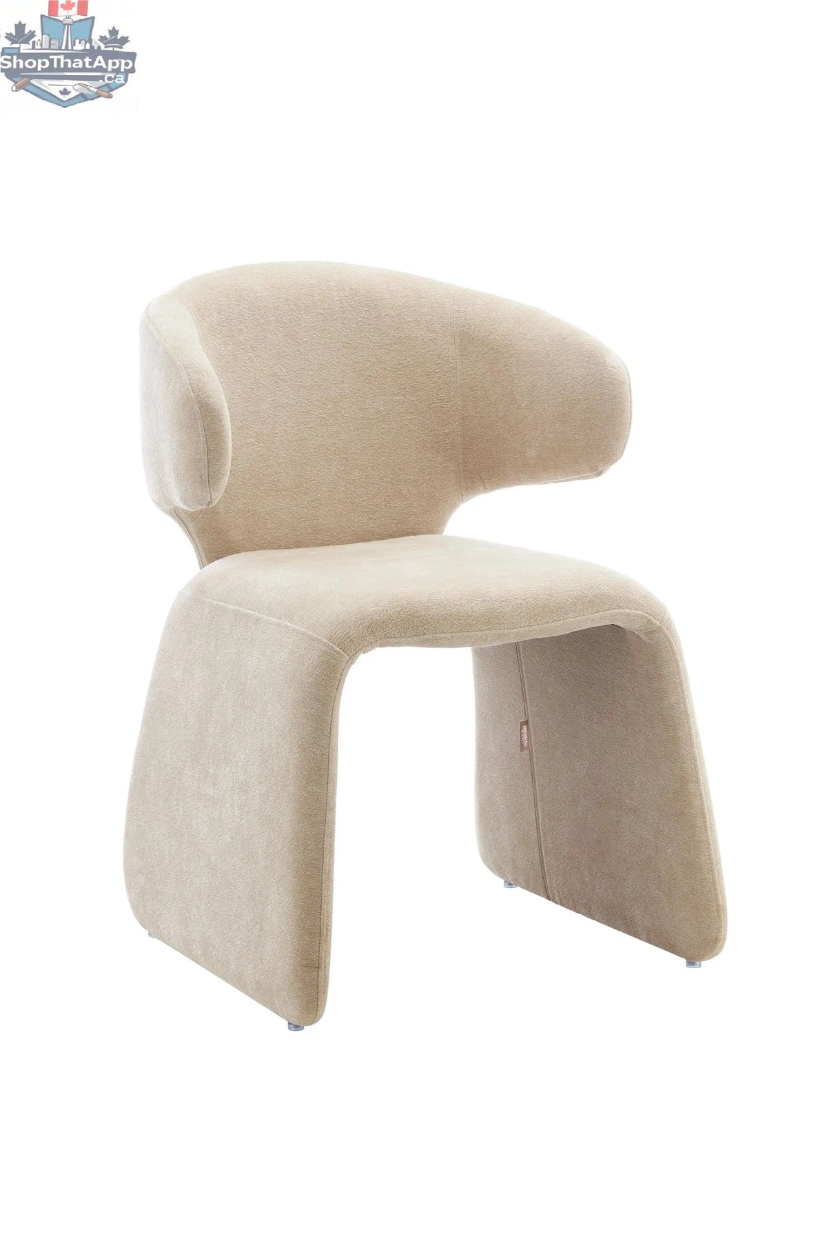 Oriana sculpted dusty beige dining chair by Hygge Design House, showcasing elegant curves and modern design for stylish dining spaces.