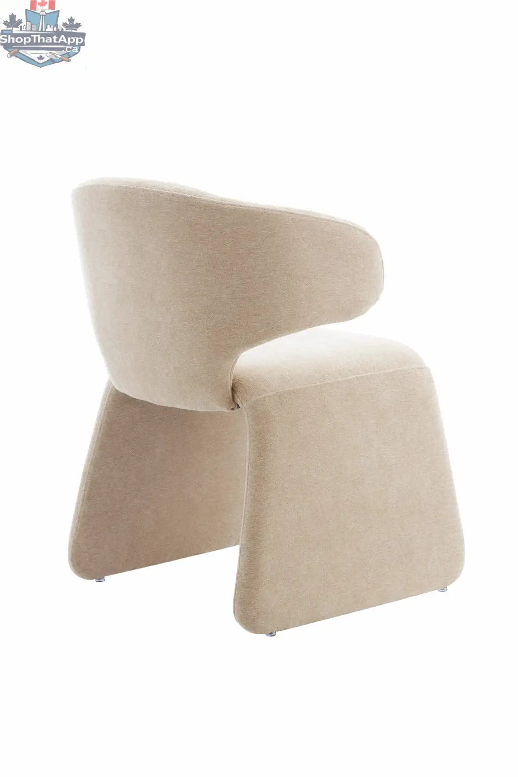 Oriana sculpted dusty beige dining chair with cross-back design from Hygge Design House, shown from an angle.