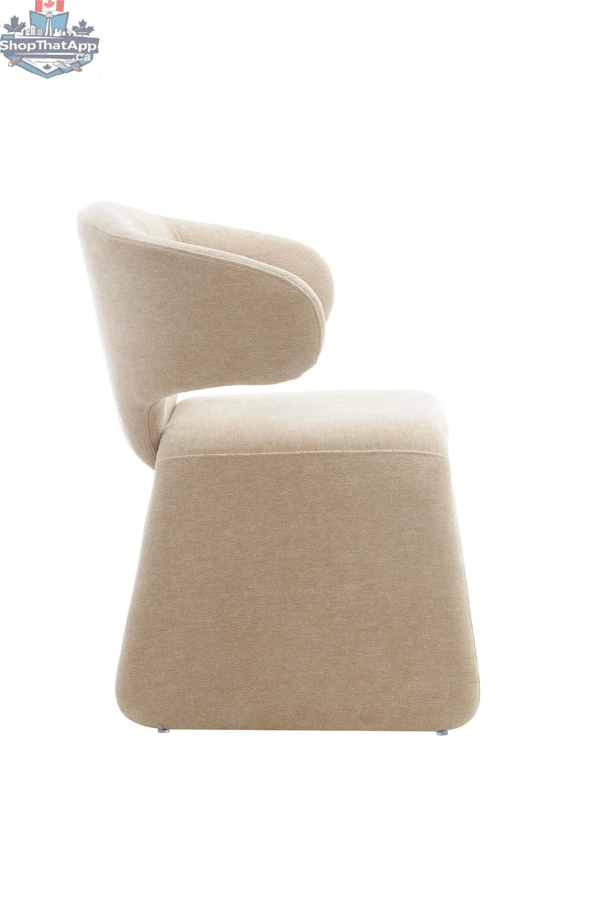 Oriana sculpted dining chair in dusty beige with wooden legs, stylish and modern for a sophisticated dining room.