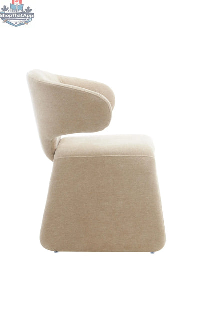 Oriana sculpted dining chair in dusty beige with wooden legs, stylish and modern for a sophisticated dining room.