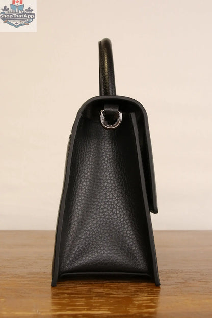 Close-up of Origyn 03 vegan leather handbag made from plastic-free MIRUM® showcasing textured surface and elegant design details.
