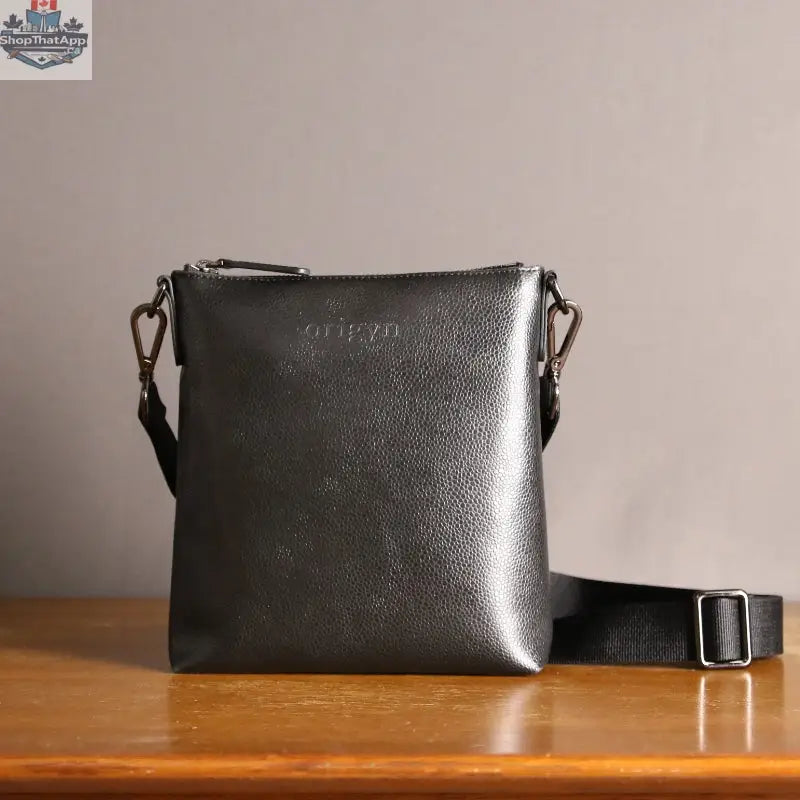 Origyn 04 vegan leather handbag with top zip closure, eco-friendly MIRUM® plastic-free material, and stylish design.