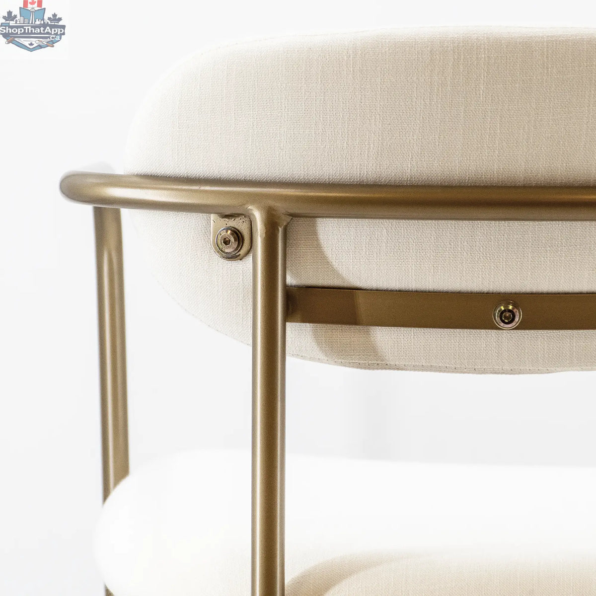 Elegant white and gold Hygge Design House Archer dining chair with sleek curves and stylish upholstery for modern home dining.