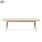 Hygge Design House Mons dining bench with wooden legs and cushioned seat, ideal for modern dining room decor.