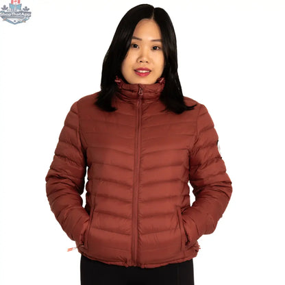 Northern Sun packable down jacket in maroon, showing a lightweight, insulated jacket folded for easy packing and storage.
