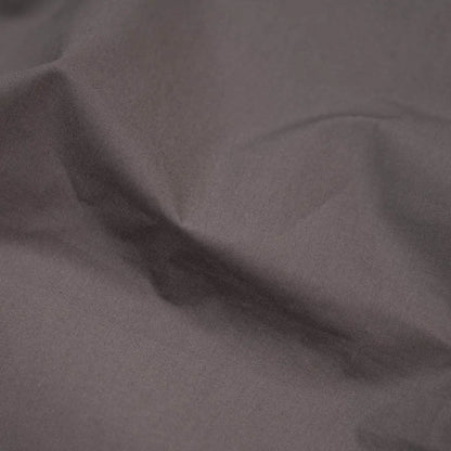 Charcoal organic percale sheets from Skylark+Owl Canada, showcasing a luxurious, crisp sheet set with neatly folded sheets.
