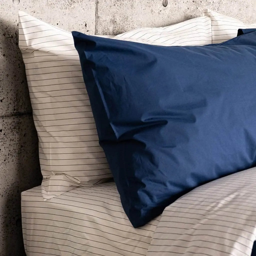 Charcoal striped organic cotton pillowcase set by Skylark+Owl Canada for luxurious sleep, featuring soft percale fabric and classic design.