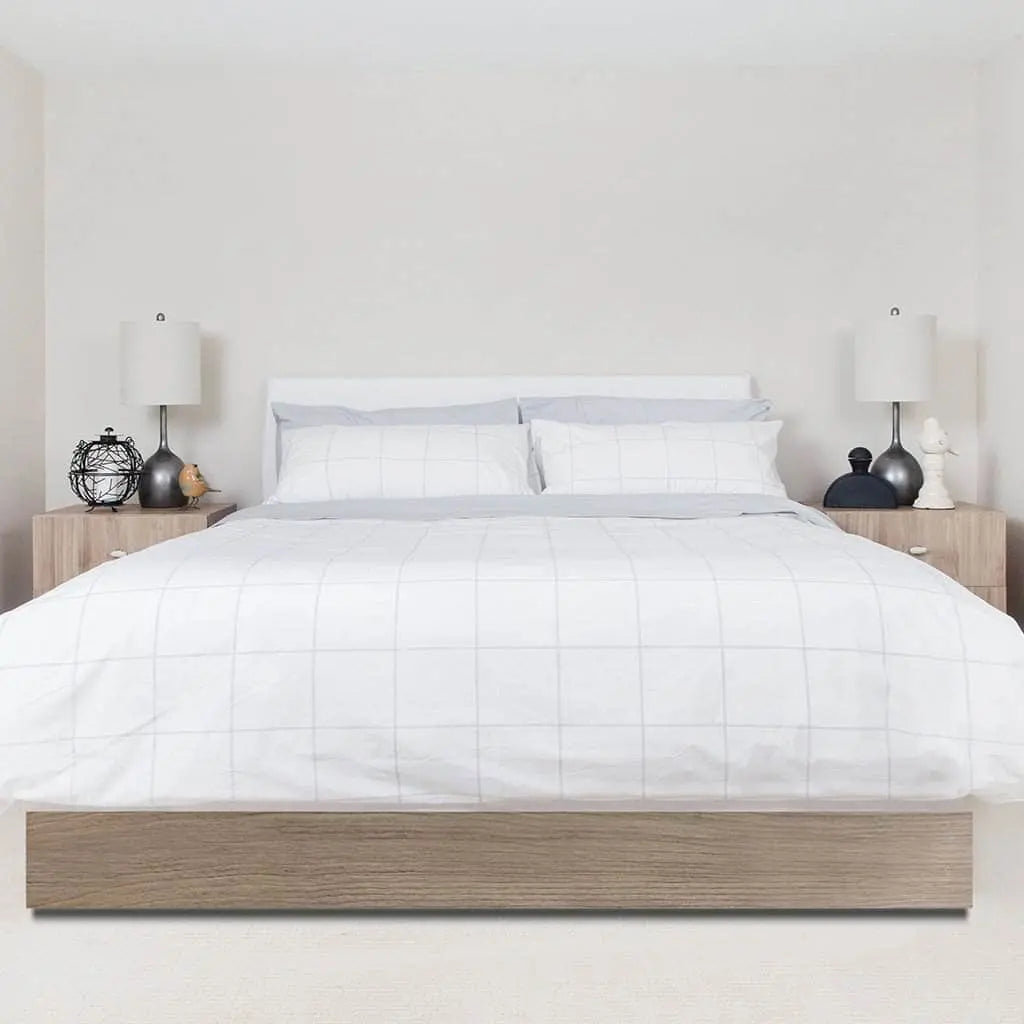 Luxurious organic percale sheets set by Skylark+Owl Canada, featuring crisp, breathable cotton sheets in a soft, elegant design.