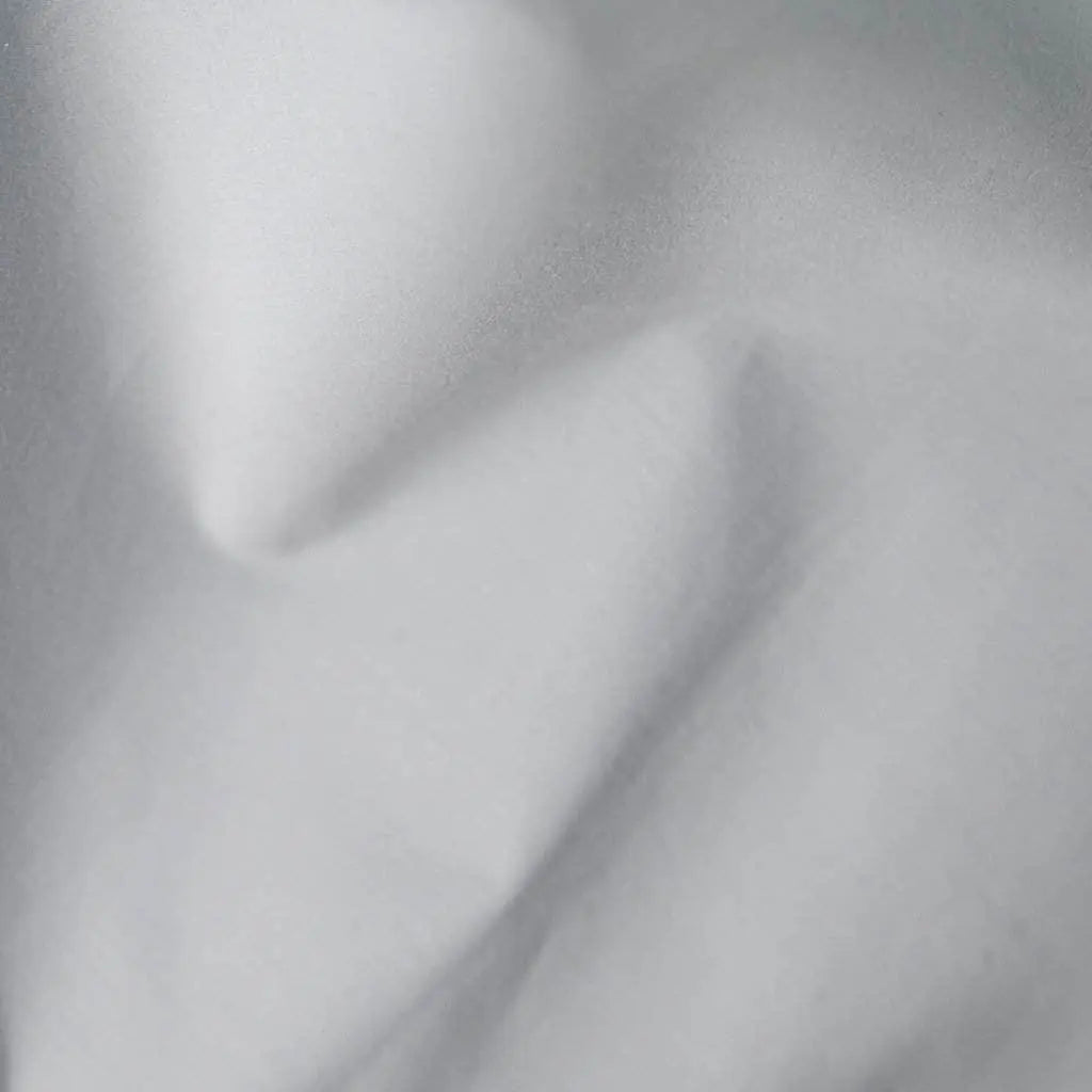 Light grey organic percale sheets from Skylark+Owl Canada, part of the luxurious Essential Organic Percale Sheets Collection.