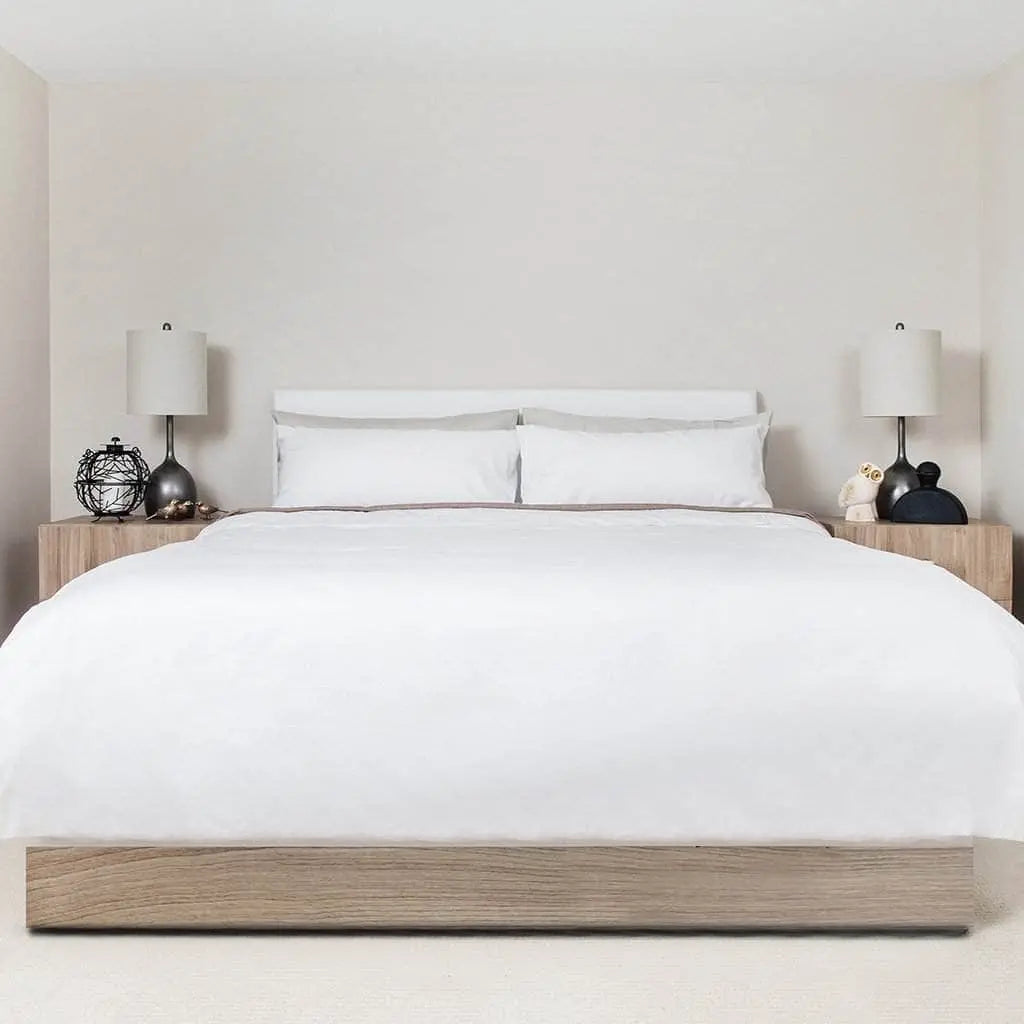 White Skylark+Owl Canada sateen duvet cover with smooth, refined fabric for an elegant bedroom aesthetic.