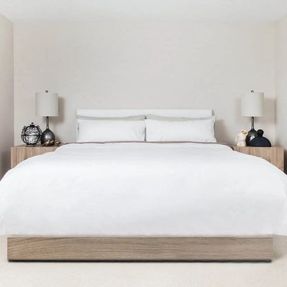 White Skylark+Owl Canada sateen duvet cover with smooth, refined fabric for an elegant bedroom aesthetic.