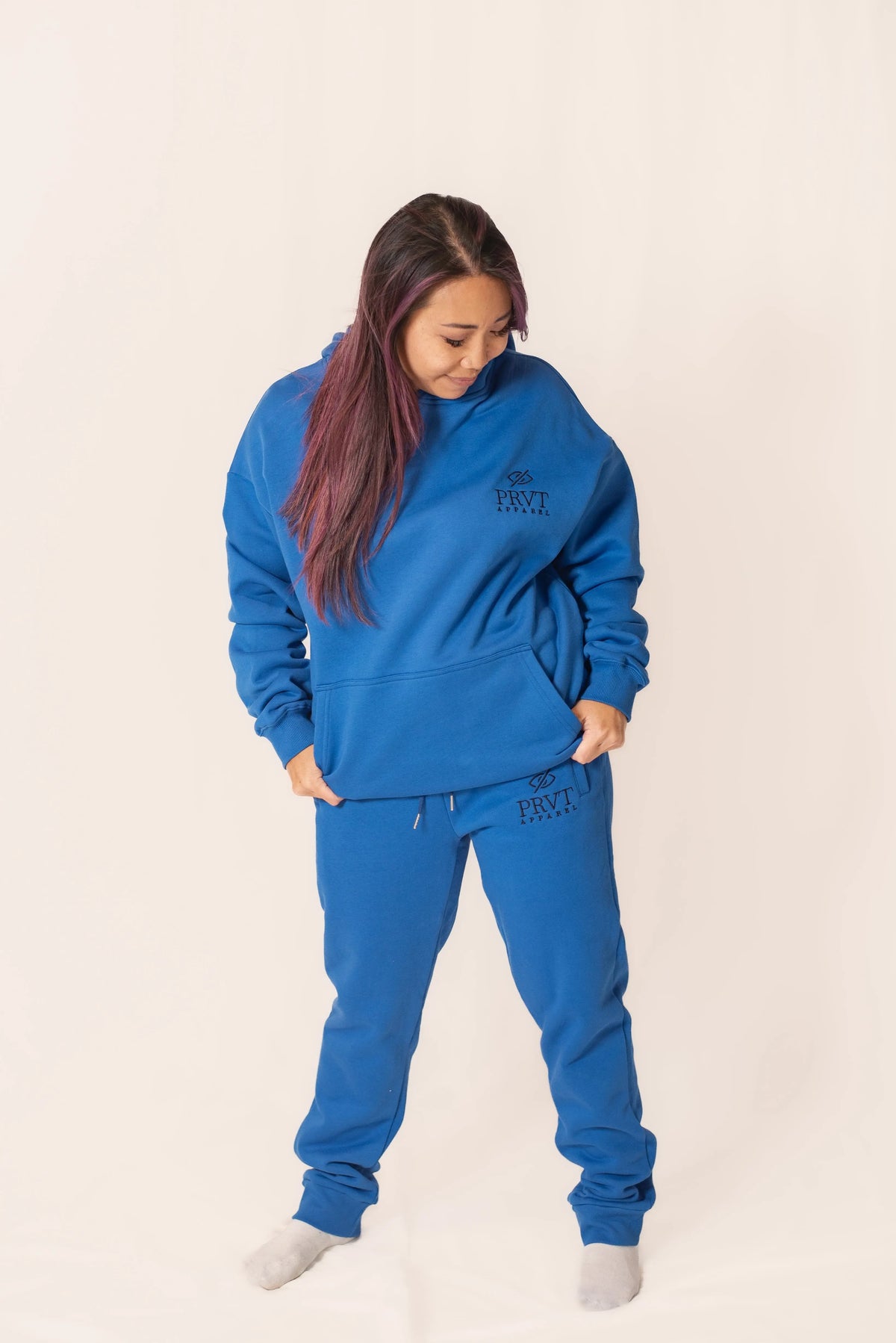 Black PRVT Apparel Inc. Signature hoodie with front pocket and drawstring hood, casual and comfortable for everyday wear.