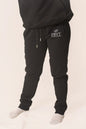 Men's signature sweats by PRVT Apparel Inc. featuring a comfortable fit and stylish design, shown in a relaxed fit on a model.