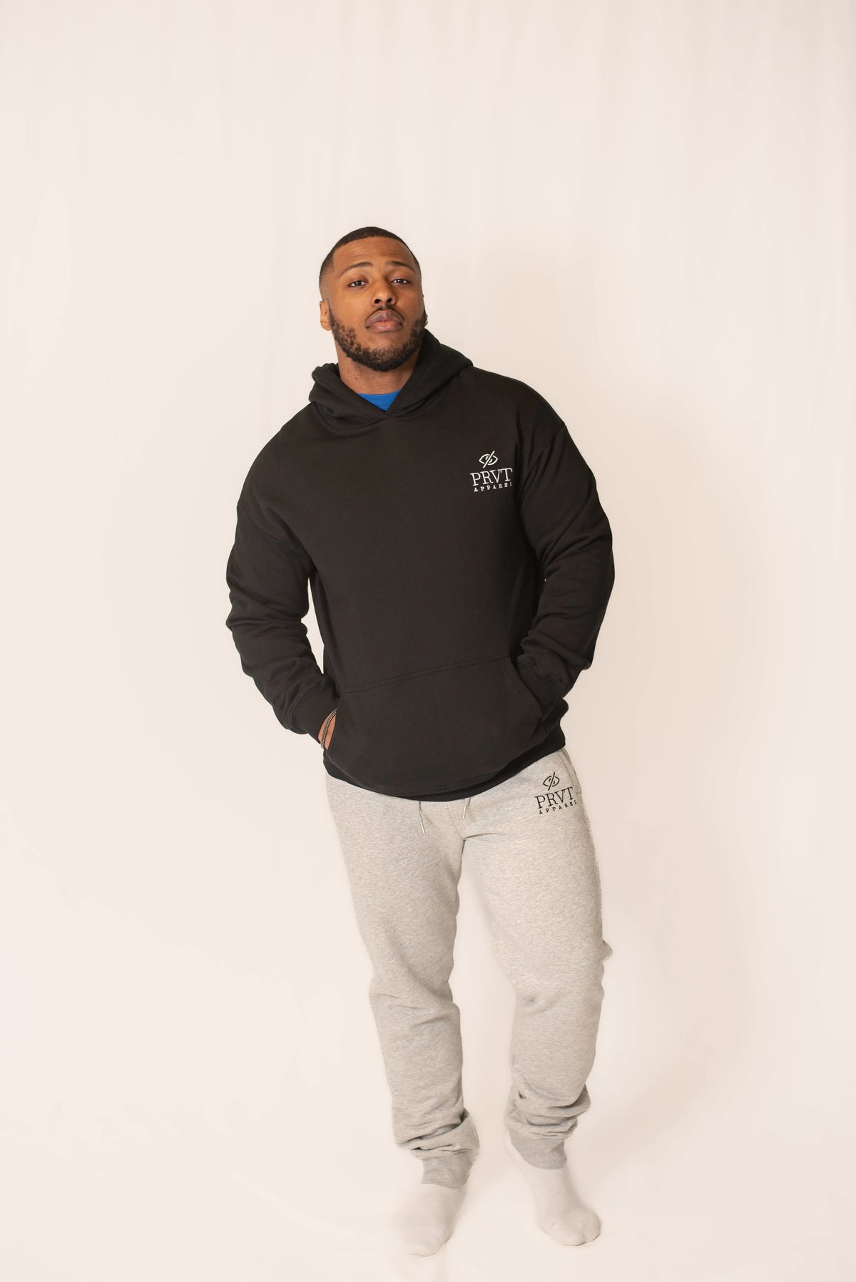 Black PRVT Apparel Inc. Signature hoodie with front pocket and drawstring hood, casual fit, displayed on a plain background.
