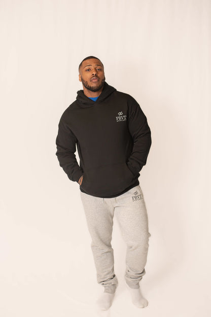 Black PRVT Apparel Inc. Signature hoodie with front pocket and drawstring hood, casual fit, displayed on a plain background.