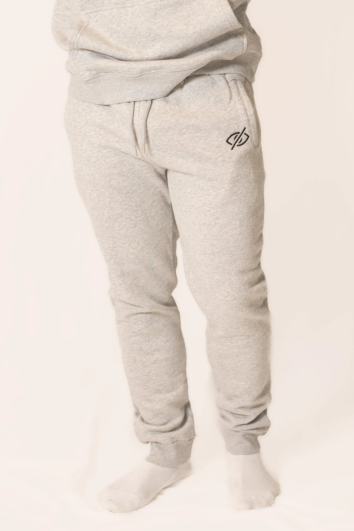 Soft gray classic sweats from PRVT Apparel Inc., featuring a relaxed fit and subtle branding, perfect for casual wear.