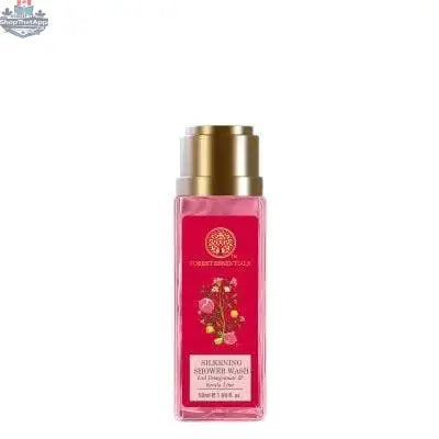 Forest Essentials Silkening Shower Wash with iced pomegranate and Kerala lime, featuring a clear bottle with a golden cap and refreshing ingredients.