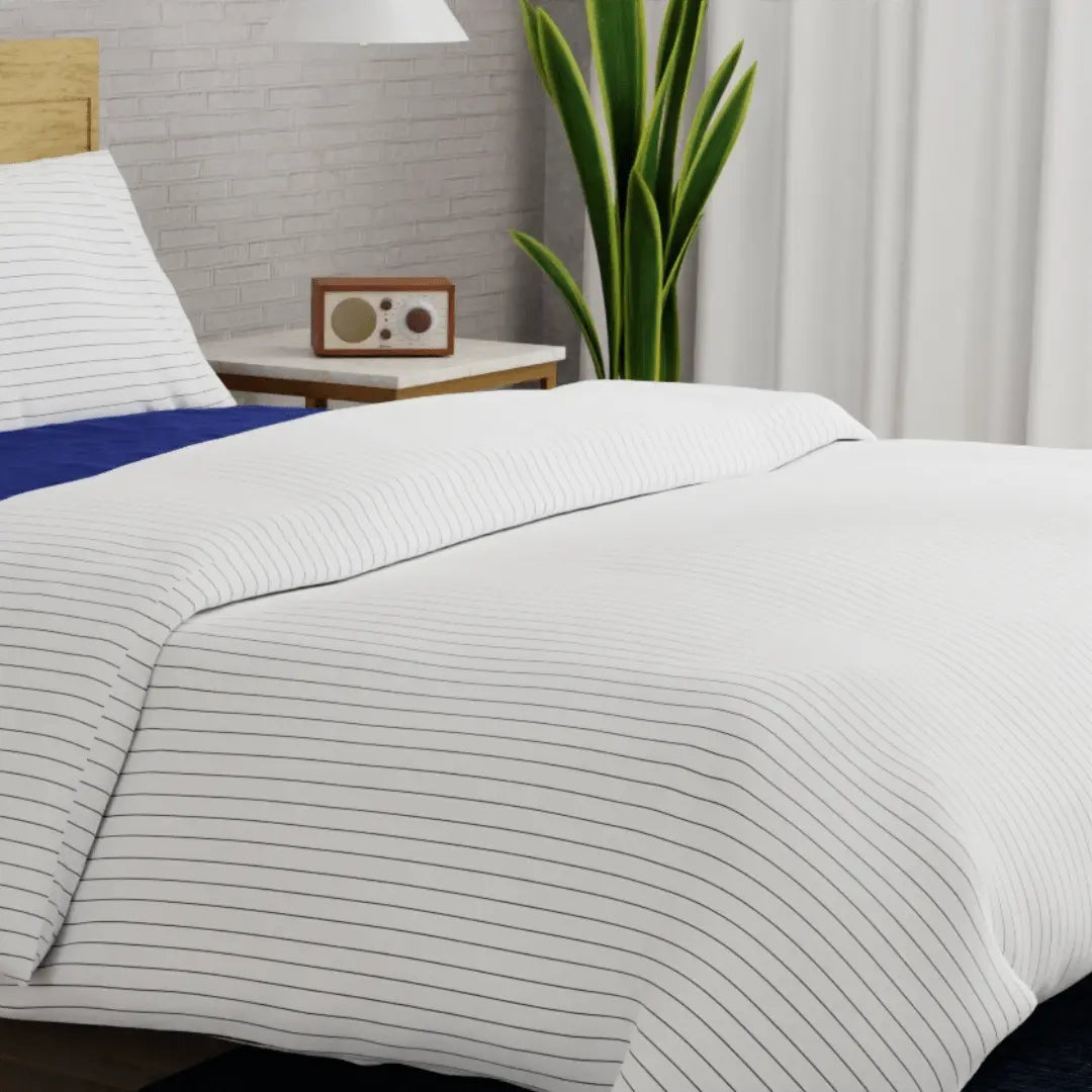 Luxurious organic percale sheet set from Skylark+Owl Canada featuring crisp, smooth sheets in a cozy bedroom setting.