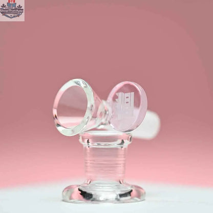 Pink 14mm borosilicate glass bowl with round tab handle from Castle Glassworks against a pink background.