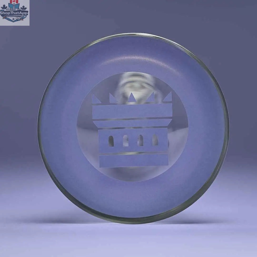 Close-up of Castle Glassworks 14-inch beaker bong with purple logo and purple background, showing the base and 9-hole downstem.