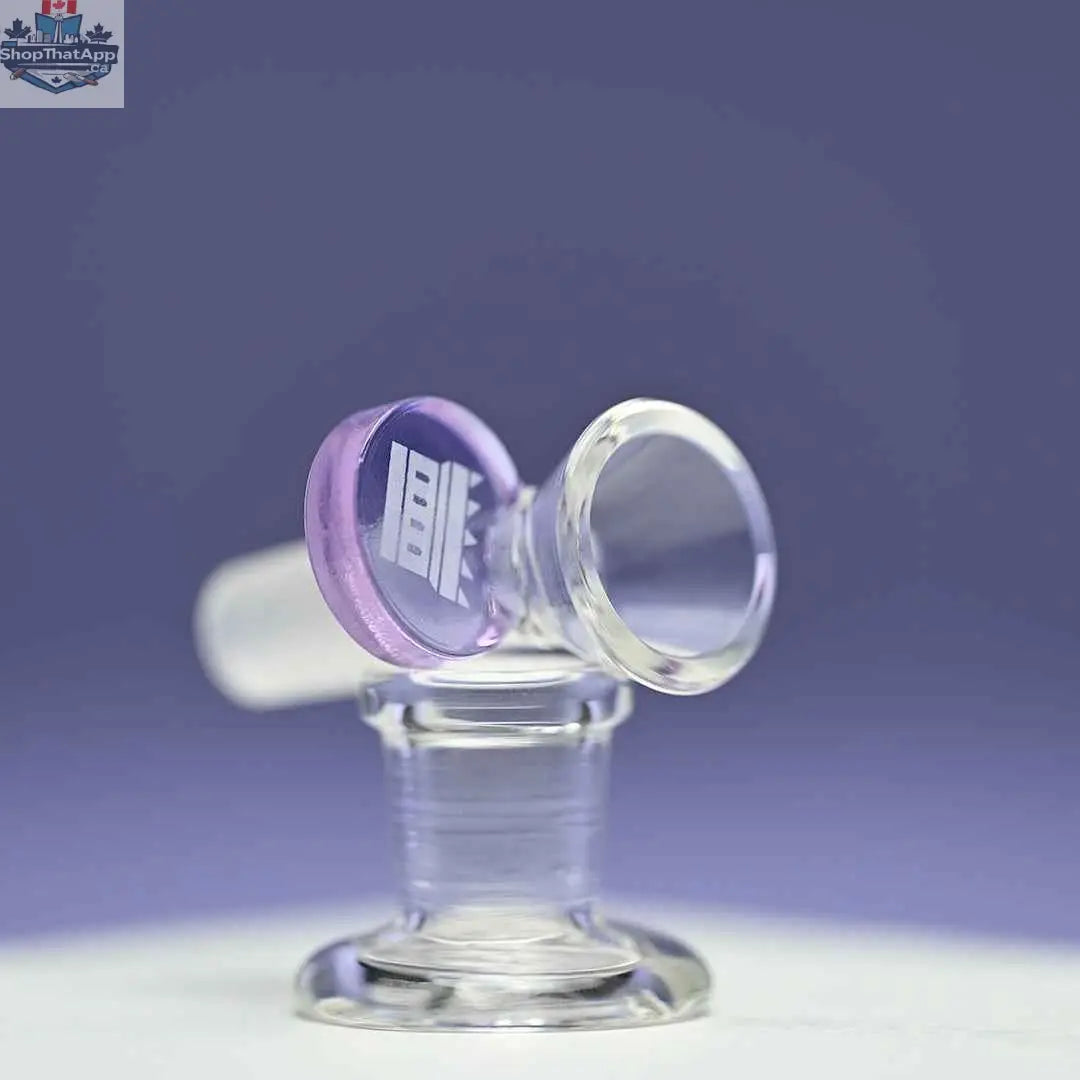 Purple 14mm borosilicate glass bowl with round tab handle by Castle Glassworks on purple background.
