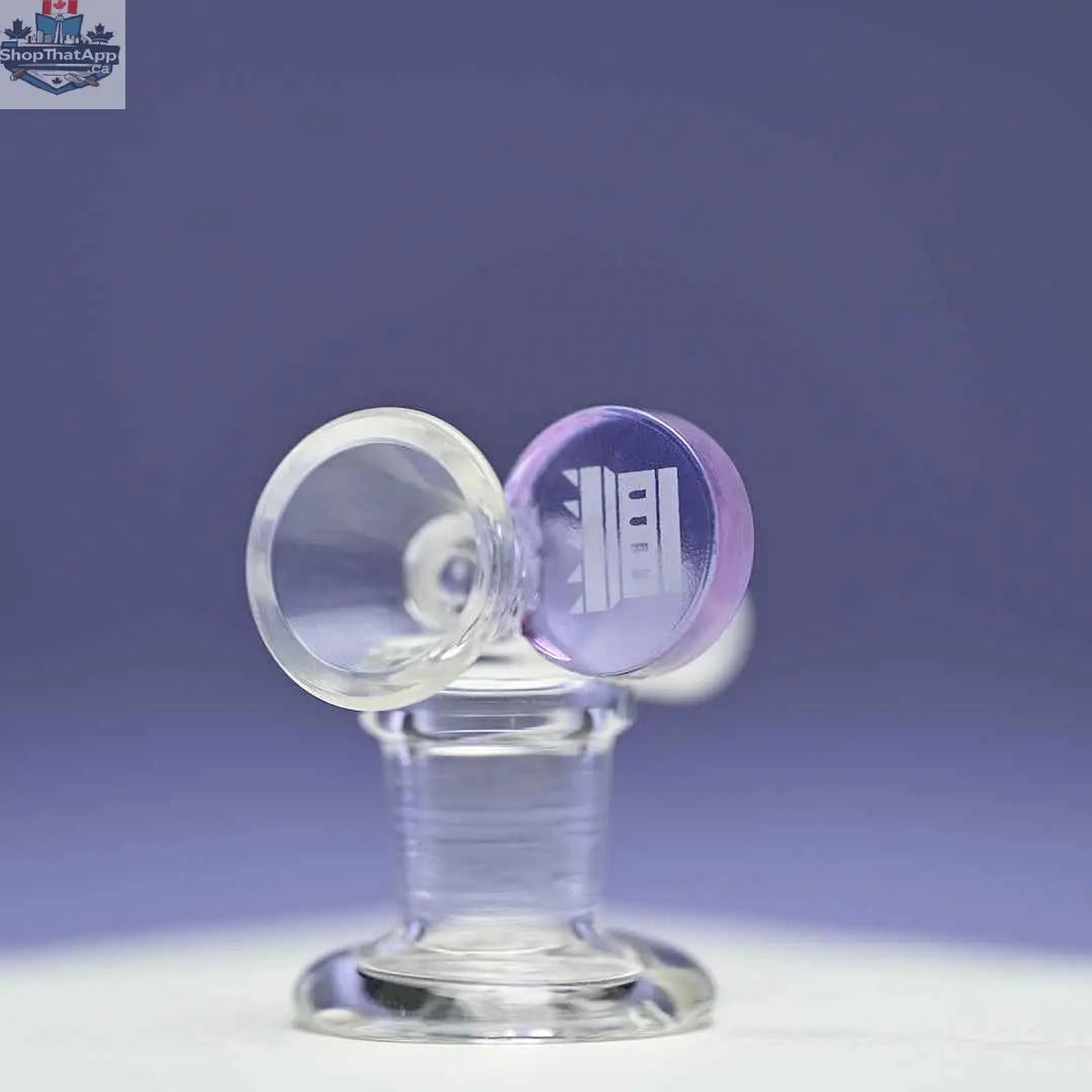 Castle Glassworks 14mm borosilicate glass round tab bowl with purple accents on a matching purple background.