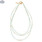 Elegant triple strand pearl necklace by Suzie Blue Canada featuring classic white pearls and a sophisticated design.