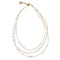 Triple strand pearl necklace by Suzie Blue Canada featuring elegant design and lustrous white pearls.