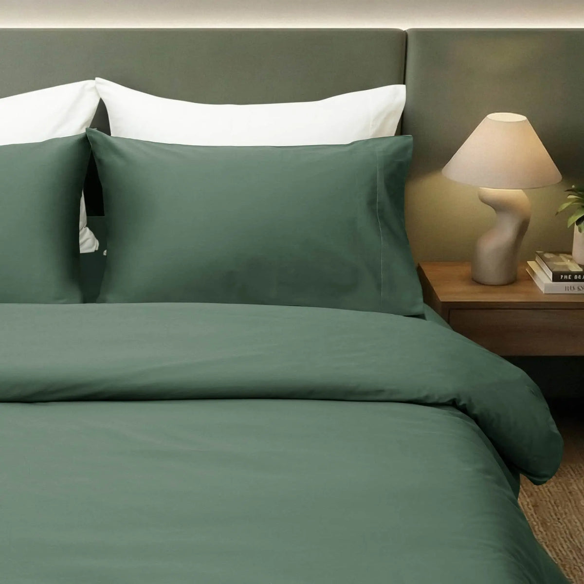 Luxurious forest green Skylark+Owl Canada refined sateen sheet set, soft and smooth bedding for a comfortable bedroom.