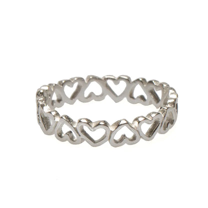 Suzie Blue Canada multi heart ring featuring layered silver-tone hearts on a sleek band, elegant jewelry for women.