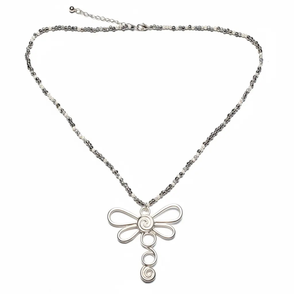 Silver dragonfly necklace on a cube chain, featuring a delicate dragonfly pendant, by Suzie Blue Canada.