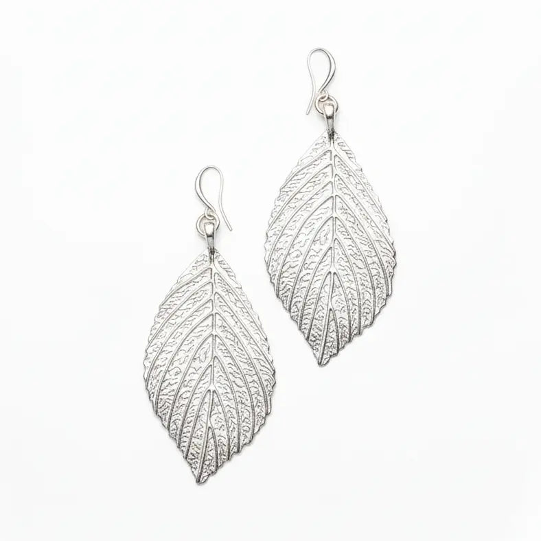 Silver plate large leaf earrings featuring elegant, nature-inspired design by Suzie Blue Canada.