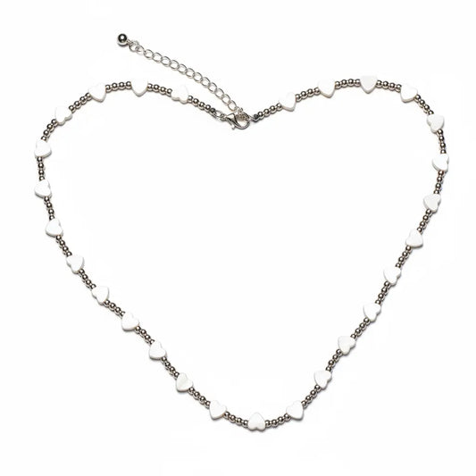 Silver plated short heart necklace by Suzie Blue Canada featuring a stylish and elegant jewelry design.