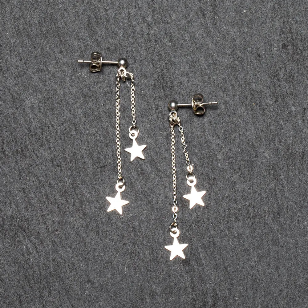 Silver plate double drop star earrings by Suzie Blue Canada featuring dangling star design and polished finish.