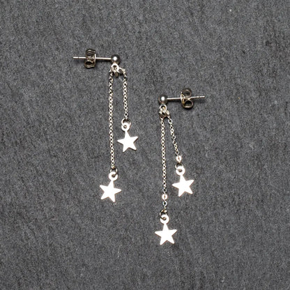 Silver plate double drop star earrings by Suzie Blue Canada featuring dangling star design and polished finish.