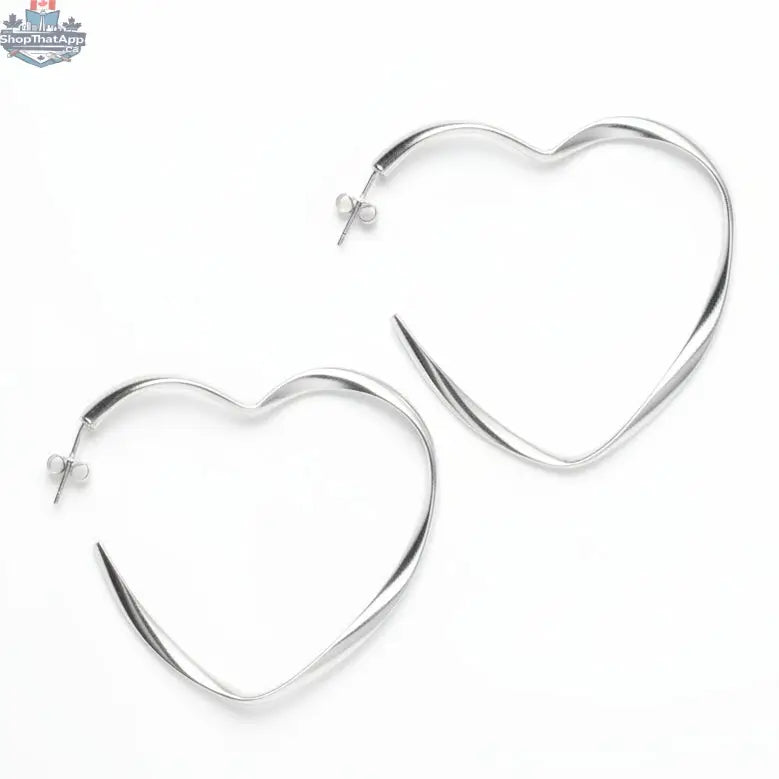 Silver-plated large heart hoop earrings by Suzie Blue Canada, featuring bold heart-shaped design and shiny finish.