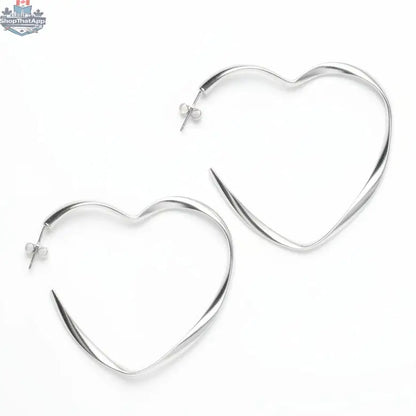 Silver-plated large heart hoop earrings by Suzie Blue Canada, featuring bold heart-shaped design and shiny finish.
