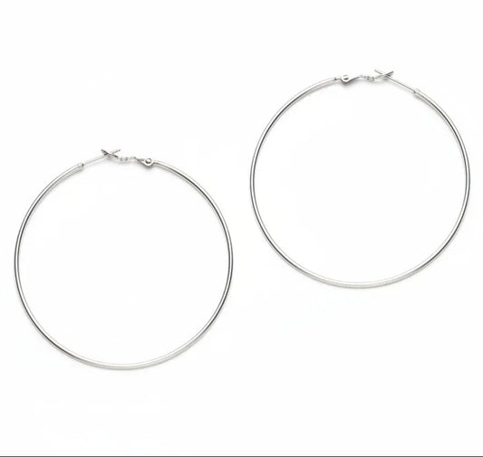 Large silver hoop earrings by Suzie Blue Canada, silver plated, with a smooth, shiny finish and classic circular design.