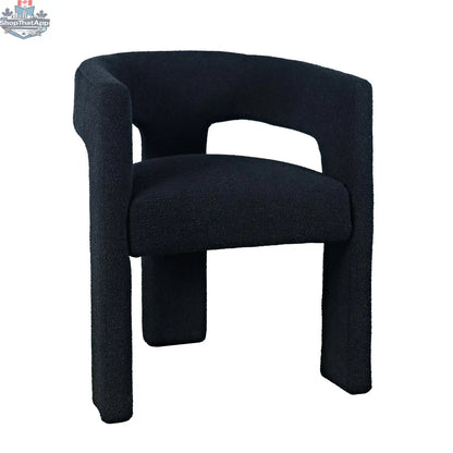 Sven upholstered dining chair in bouclé fabric with black finish, showcasing modern design and plush textured upholstery.