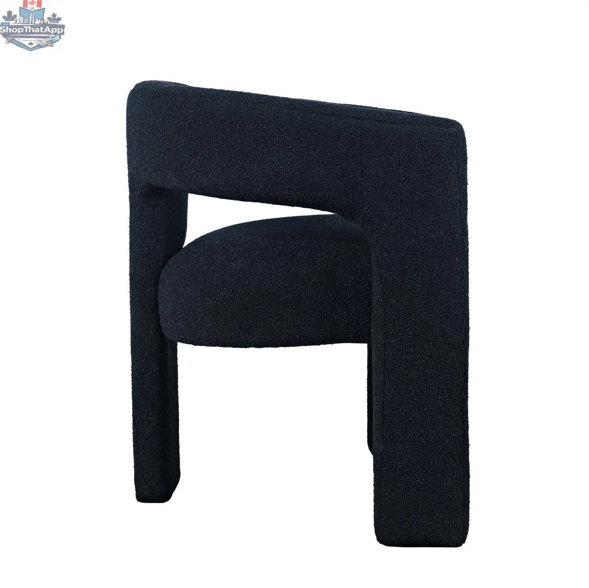 Sven upholstered dining chair in black bouclé fabric with wooden legs, side view, by Hygge Design House