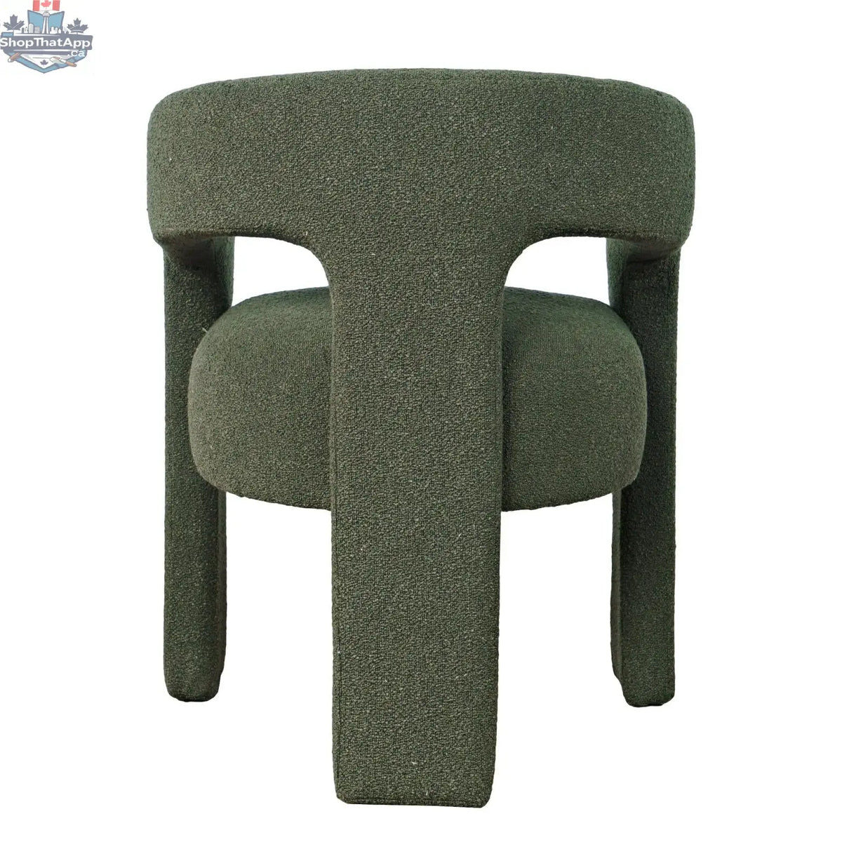 Sven upholstered dining chair in soft bouclé fabric with a curved backrest and wooden legs, designed by Hygge Design House.