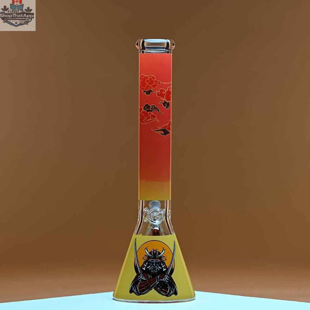 Castle Glassworks 16-inch Samurai beaker bong with amber background, 9mm thick glass for smooth, high-quality hits.