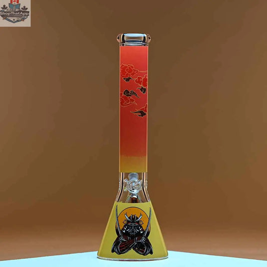 Castle Glassworks 16-inch Samurai beaker bong with amber background, 9mm thick glass for smooth, high-quality hits.